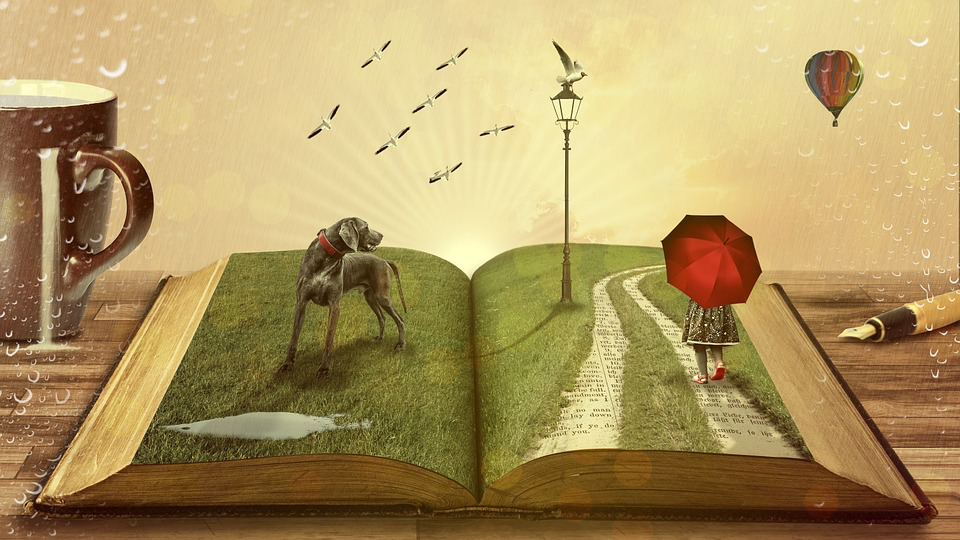 An opened book on a table that's been landscaped with green grass, a dog looking over his shoulder at a gull on a lampost as a flock of fellow gulls fly past a hot air balloon, and a young girl walks down a textual path with her umbrella