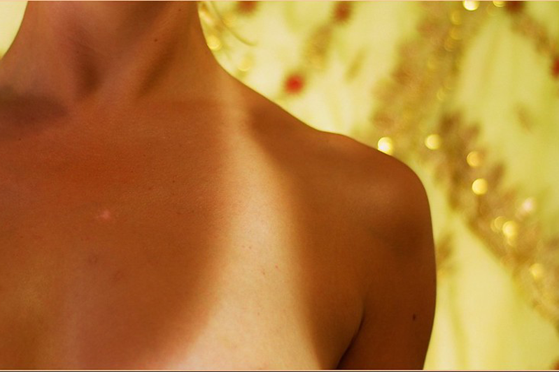 Tan line on a woman's shoulder