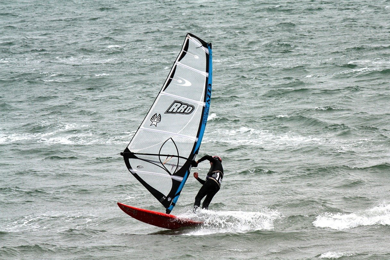 Man windsurfing in the water.