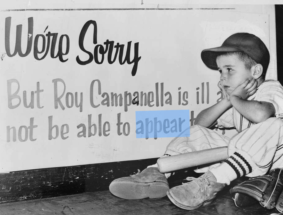 Photograph shows a disappointed Stephen Cummings, age 5, wearing baseball uniform, sitting on the sidewalk next to his baseball glove, hands on his cheeks, elbows on knees, baseball bat across his lap, looking at sign explaining that the expected visit by Roy Campanella has been canceled.