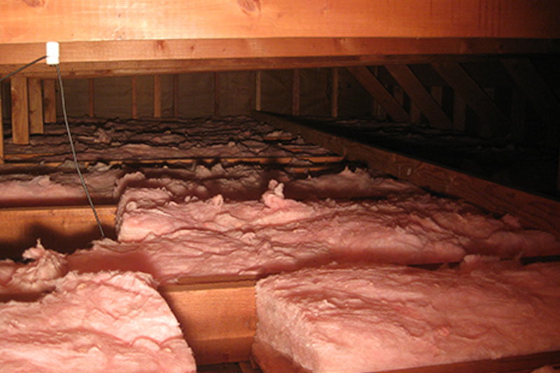 sections of pink insulation are laid out in the 