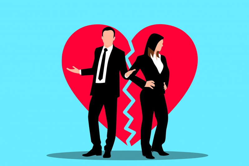 Against a light blue background is a broken heart with a zigzag down the center. On either side of the break is a man and a woman in black suits