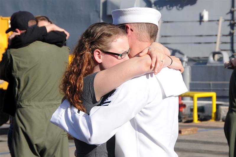 Sailors say good-bye to their loved ones as they prepare to board the guided-missile frigate USS Reuben James (FFG 57)
