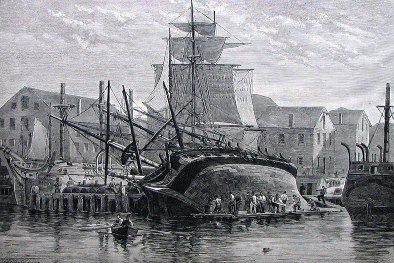 A wood engraving of an old whaling ship laid on its side being cleaned in the harbor