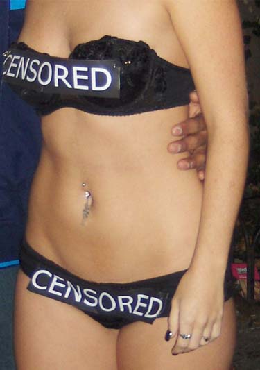Woman wearing black bra and panties has a black label saying censored across her bra and panties.