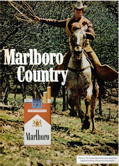 A Marlboro cowboy on a galloping horse swinging a lariat