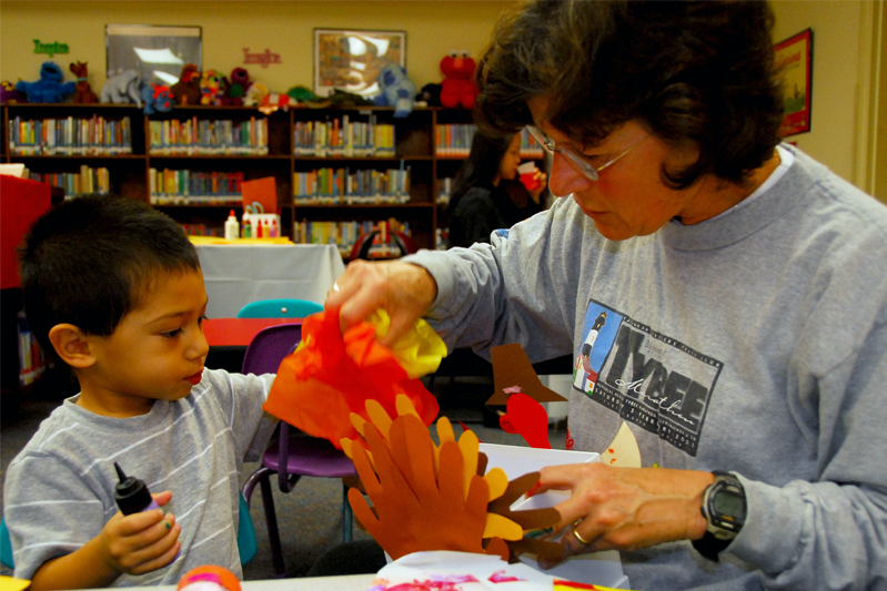Gregory and Nitsa Calas work together during Family Craft Night at the Base Library. (U.S. Air Force photo/)