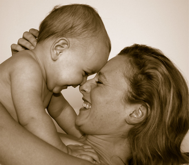 Sepia-toned photo of baby and mom