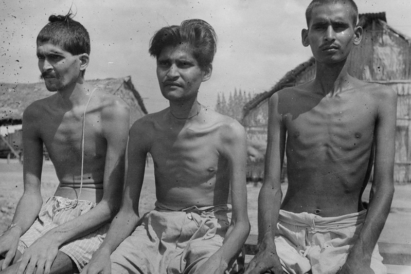 Three thin and weak prisoners of war.