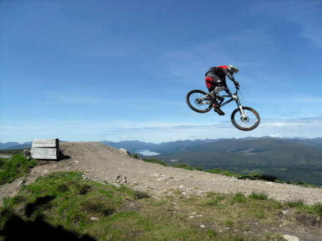 High flier doing the first jump on Britain's only official UCI World Cup Downhill Mountain bike track