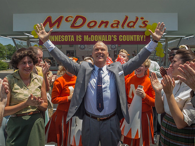 A crowd photo in front of McDonalds with Ray Kroc at the center