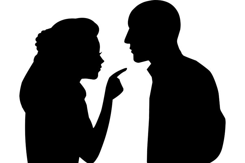 Black silhouette of a couple with the woman pointing at a finger at the man