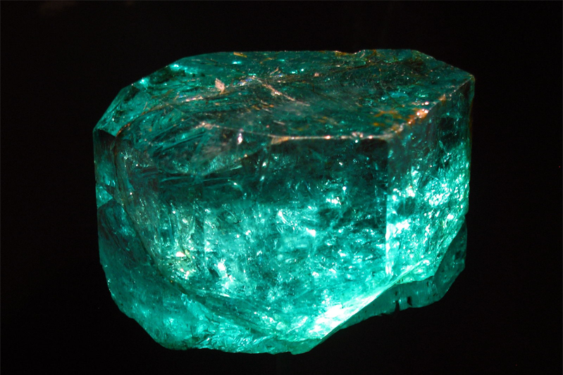 A raw chunk of an emerald gemstone