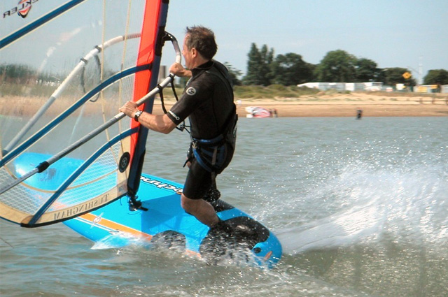 Dad pulls off a tight carve gybe (turn)