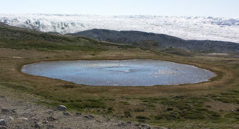 A (round glacial eye-shaped lake in a barren landscape.