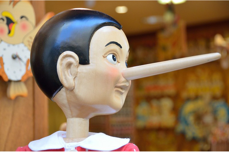 A cartoon with Pinnochio and his long nose