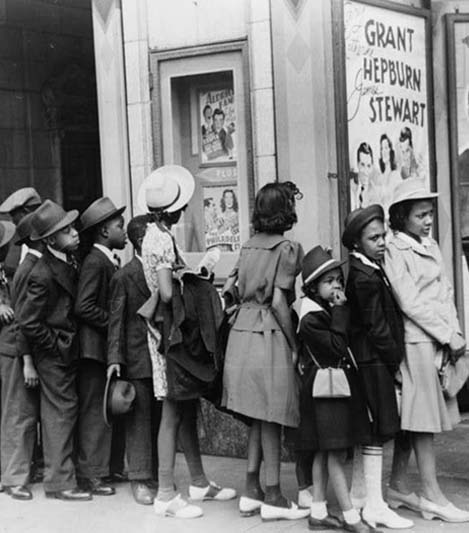 Children in front of moving picture theater