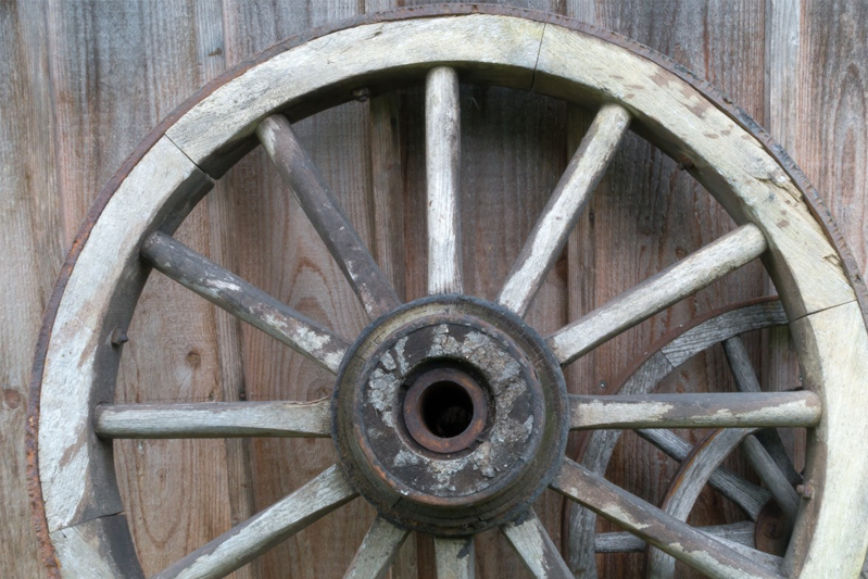 An old wheel with a rusted metal hub