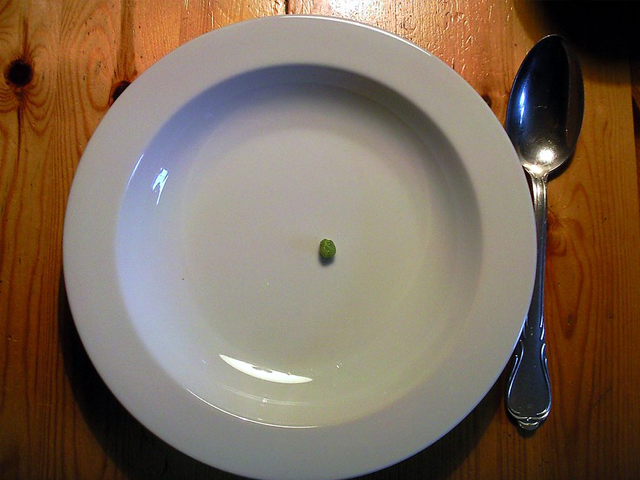One dried up pea in the middle of a soup plate