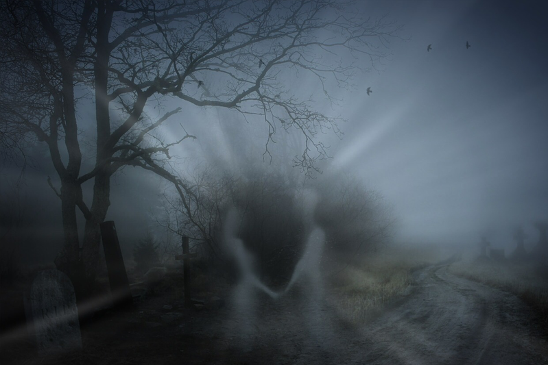 spooky setting in the fog of two ghostly figures meeting