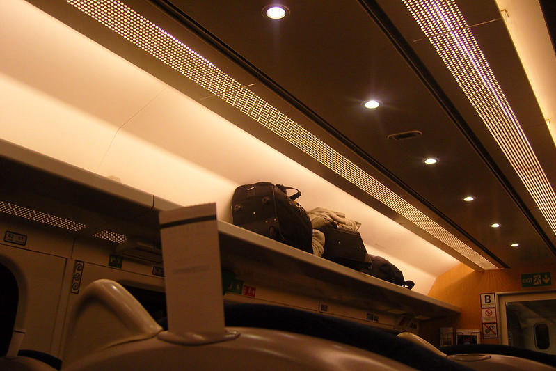 Luggage stowed away in the overhead compartment