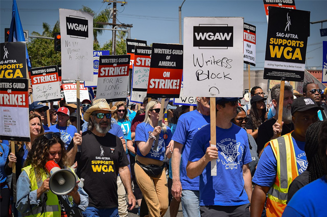 A group of people carrying signs.