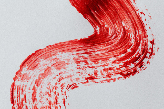 A brushstroke in red in a reverse s-curve.