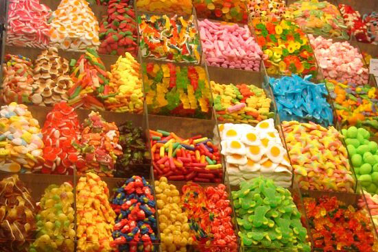 Rows of bins of colorful candies