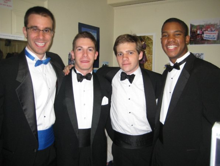 Four men wearing tuxes