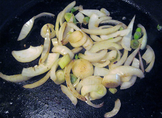 A cast iron pan with onions
