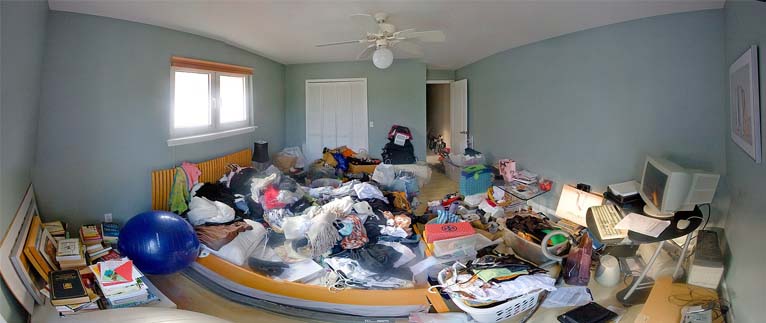 Wide angle shot of an extremely messy room